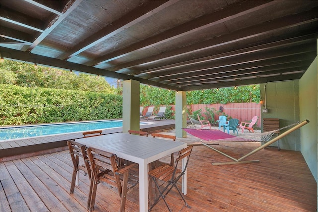 deck featuring fence and a fenced in pool