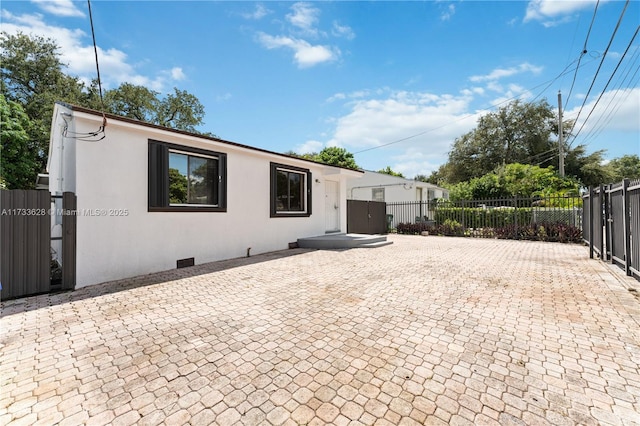 rear view of house featuring a patio