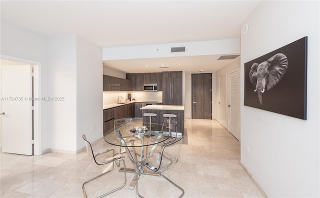 dining space with sink