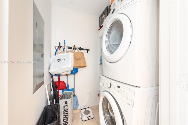 laundry area with stacked washer / dryer