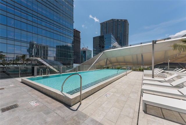 view of pool featuring a patio area