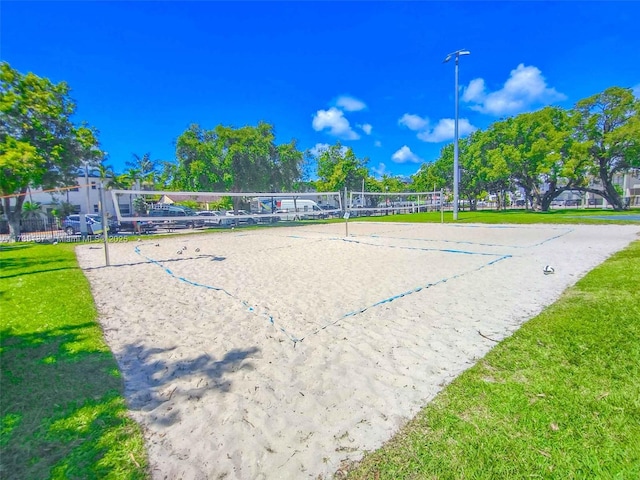 view of community featuring a yard and volleyball court