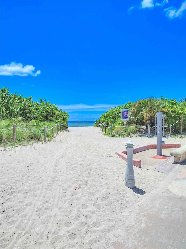 view of water feature with a beach view