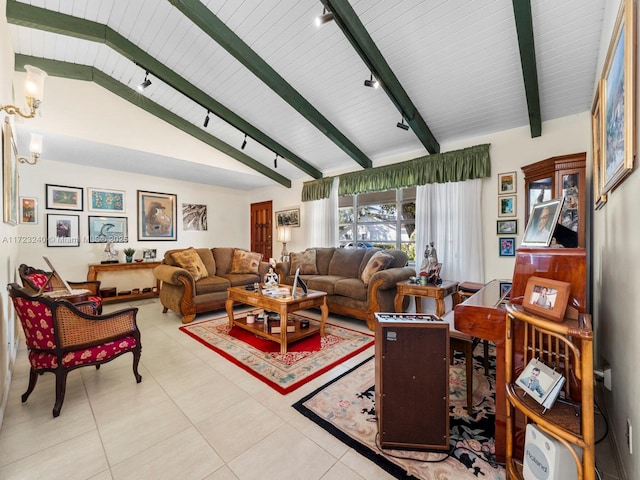 living room featuring track lighting, light tile patterned floors, and vaulted ceiling with beams