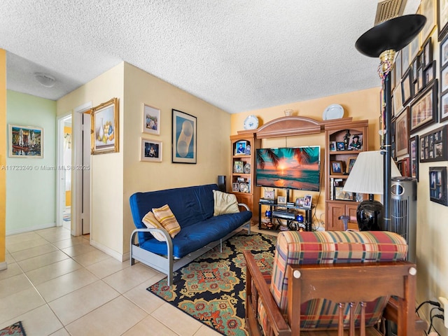 living room with light tile patterned floors and a textured ceiling