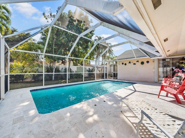 view of pool featuring a lanai and a patio area