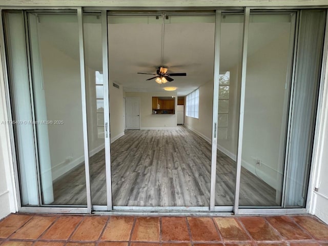 interior space featuring ceiling fan