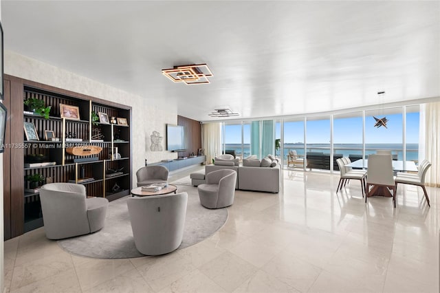 living room with a wall of windows and a wealth of natural light