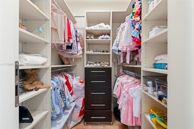 spacious closet featuring light wood-type flooring