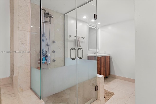 bathroom featuring an enclosed shower and vanity