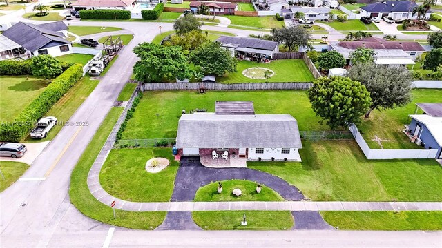 single story home with a garage and a front yard