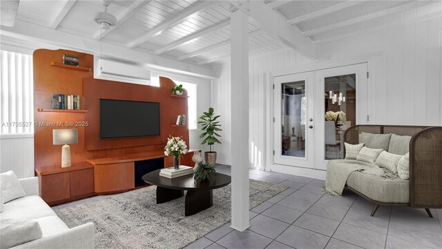 tiled living room featuring a wall unit AC, french doors, and beamed ceiling