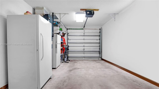 garage with a garage door opener and white refrigerator