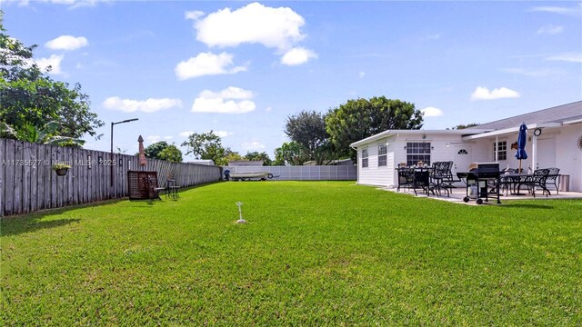 rear view of property with a yard