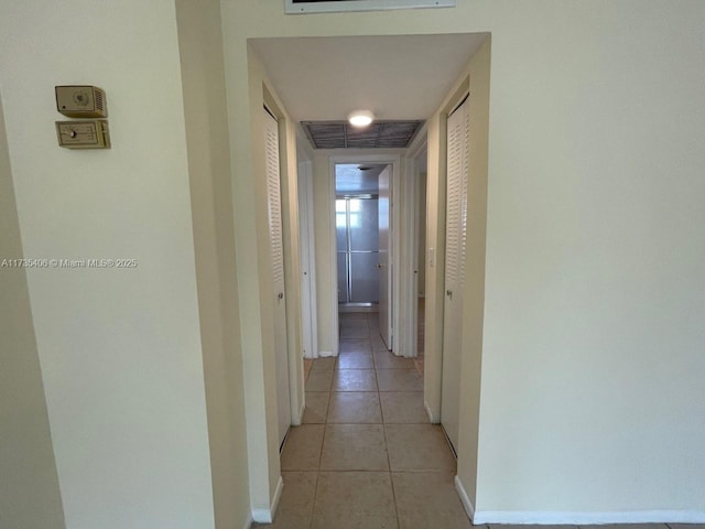 hallway with light tile patterned floors
