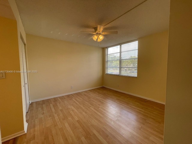 unfurnished room featuring ceiling fan and light hardwood / wood-style floors