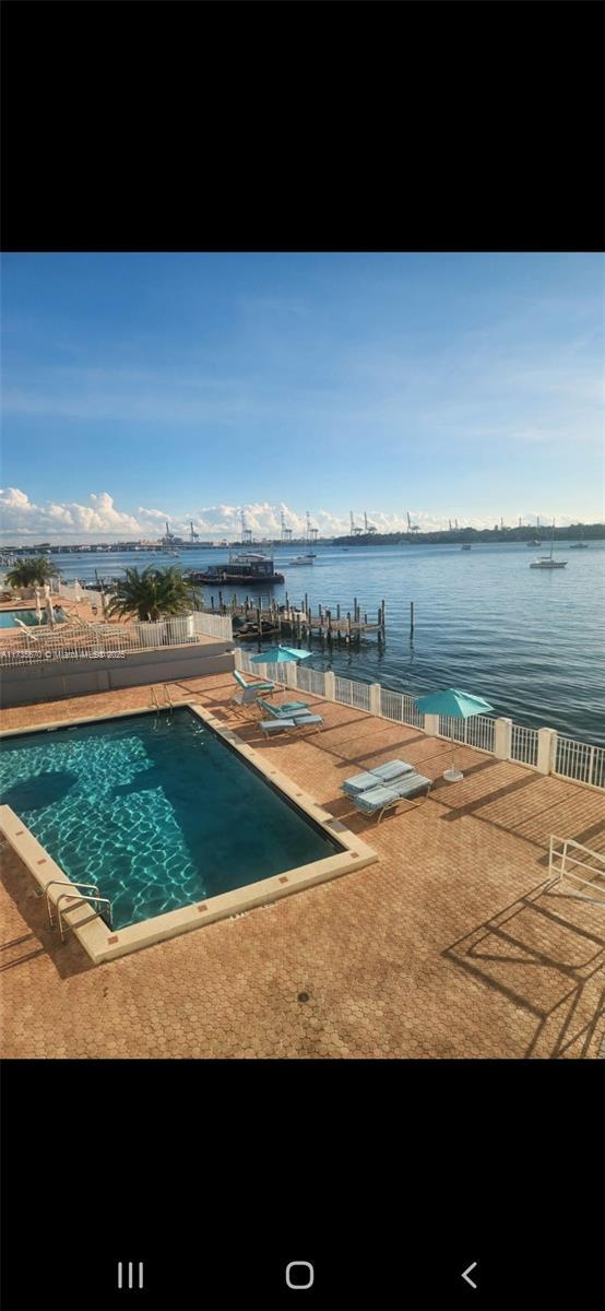 view of pool with a water view