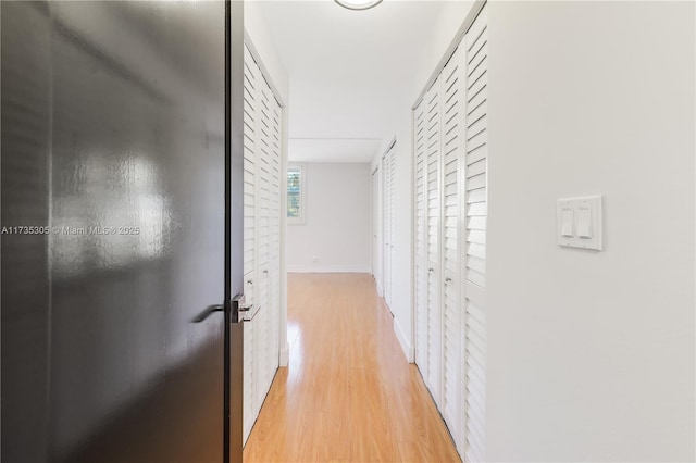 hall with light hardwood / wood-style flooring