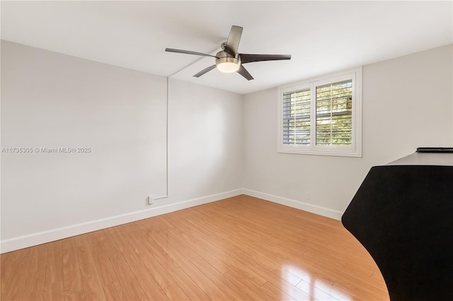 unfurnished room featuring ceiling fan and light hardwood / wood-style flooring