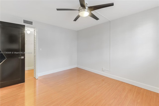 unfurnished room featuring ceiling fan and light wood-type flooring