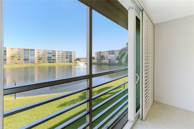 unfurnished sunroom with a water view