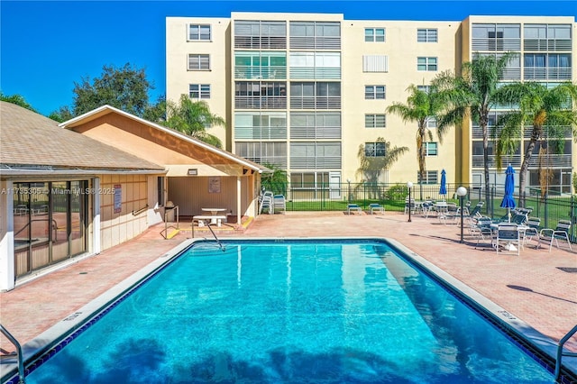 view of swimming pool featuring a patio area