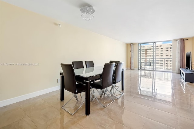 dining space with a wall of windows and light tile patterned floors