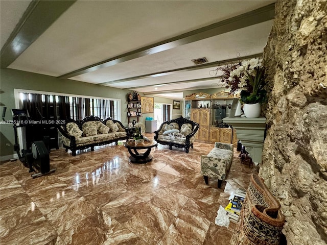 living room featuring beamed ceiling