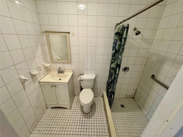 bathroom with vanity, a shower with shower curtain, tile walls, and toilet