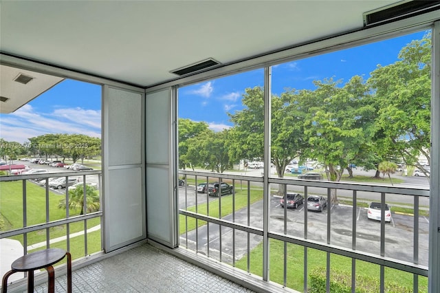 unfurnished sunroom featuring a healthy amount of sunlight