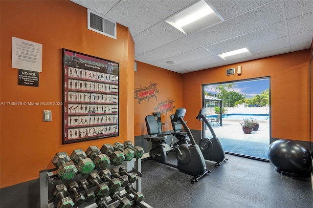 gym with a drop ceiling