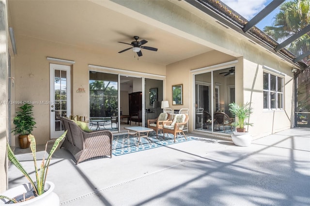 view of patio / terrace with a lanai and a ceiling fan