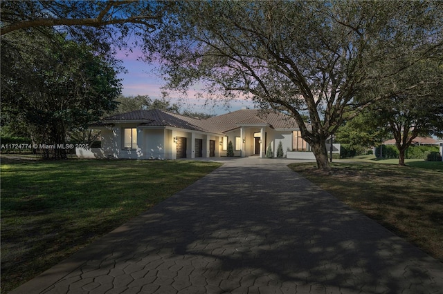 mediterranean / spanish-style home featuring a yard