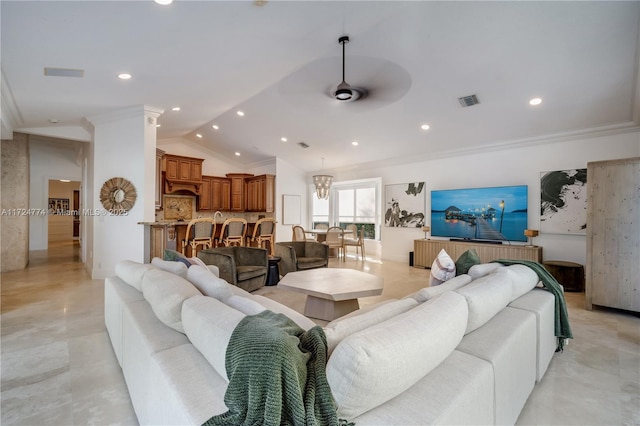 living room featuring lofted ceiling, ornamental molding, and ceiling fan