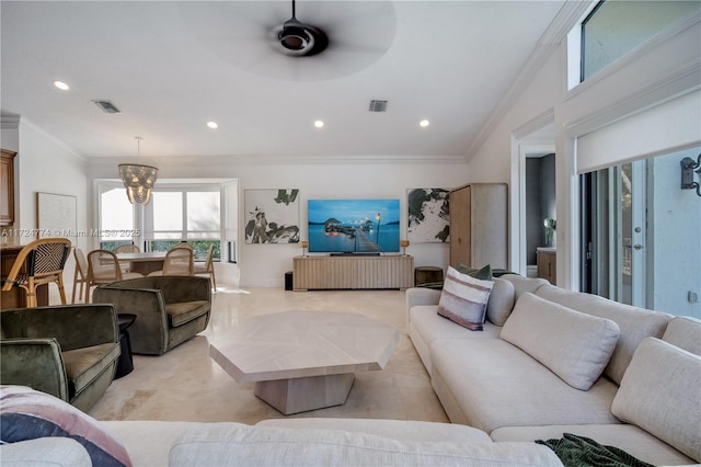 living room featuring ornamental molding and ceiling fan