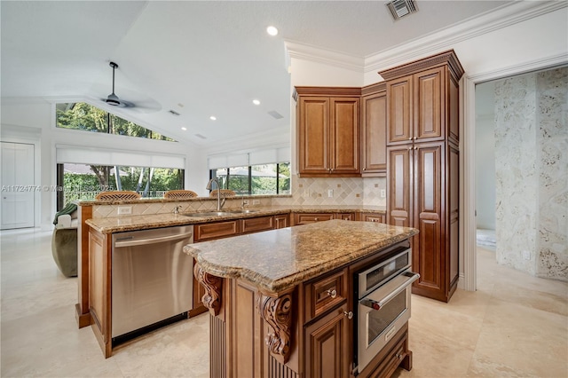 kitchen with sink, stainless steel appliances, a center island, light stone countertops, and vaulted ceiling