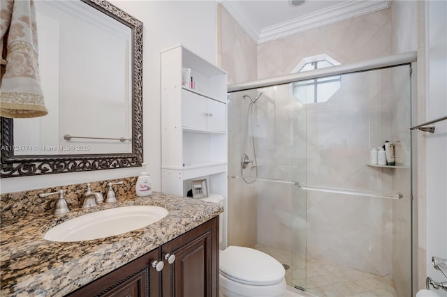 bathroom with vanity, ornamental molding, toilet, and walk in shower