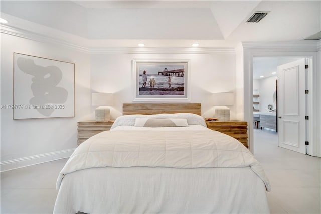 bedroom featuring ornamental molding and a tray ceiling