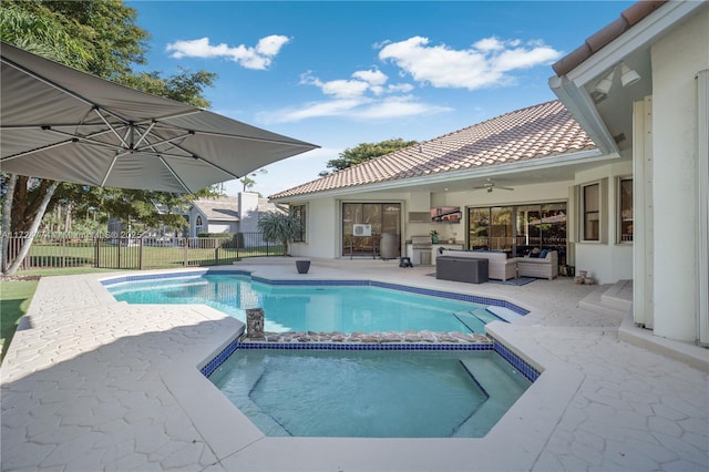 view of swimming pool with an outdoor hangout area, a patio, and ceiling fan