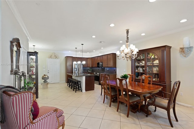 dining room with light tile patterned flooring, crown molding, and an inviting chandelier