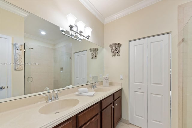 bathroom with crown molding, vanity, tile patterned flooring, and a shower with door