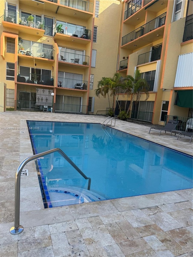 view of pool featuring a community hot tub