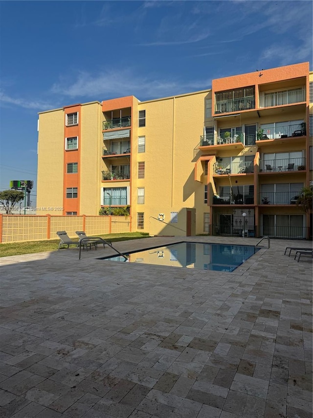 view of swimming pool with a patio area