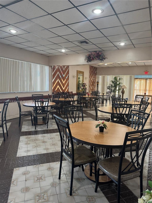 dining room featuring a drop ceiling and recessed lighting