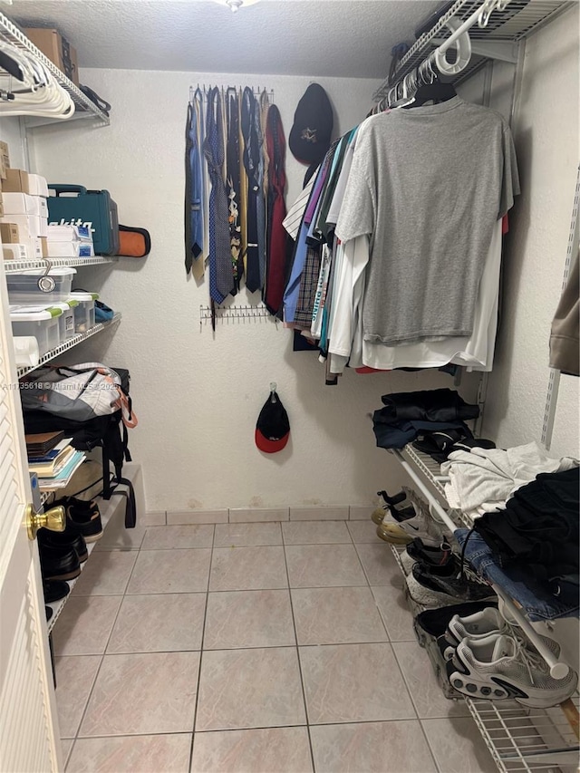 walk in closet featuring tile patterned flooring