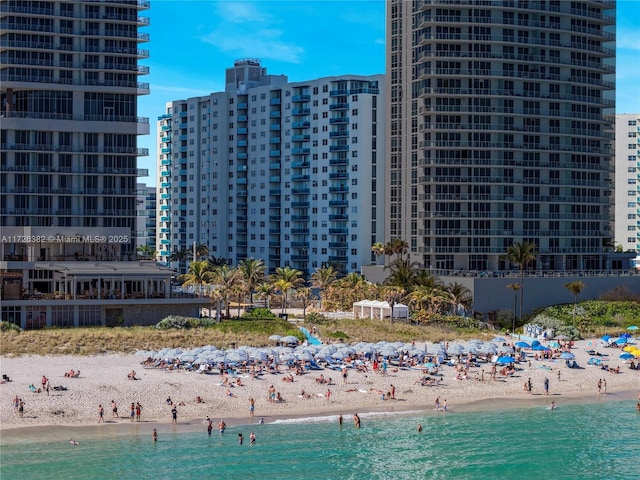 exterior space featuring a view of the beach and a water view