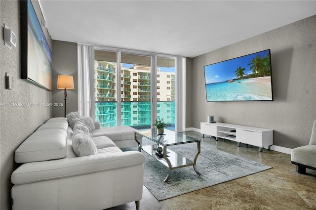 living room featuring floor to ceiling windows