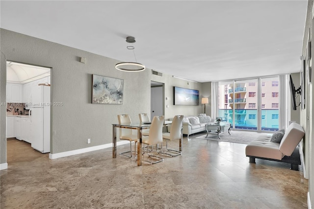 dining room featuring expansive windows