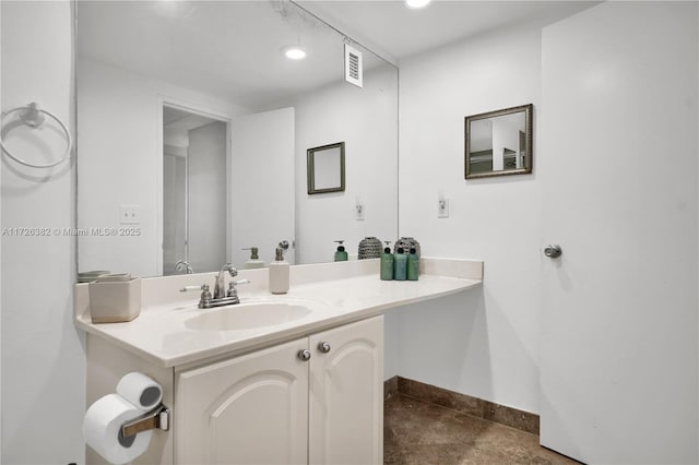 bathroom featuring tile patterned flooring and vanity