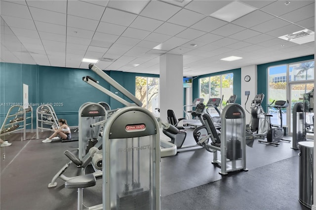 exercise room with a drop ceiling